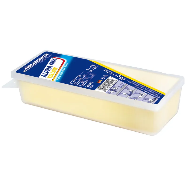 Gelbes Holmenkol Alphamix Skiwachs in einer transparenten Kunststoffverpackung.