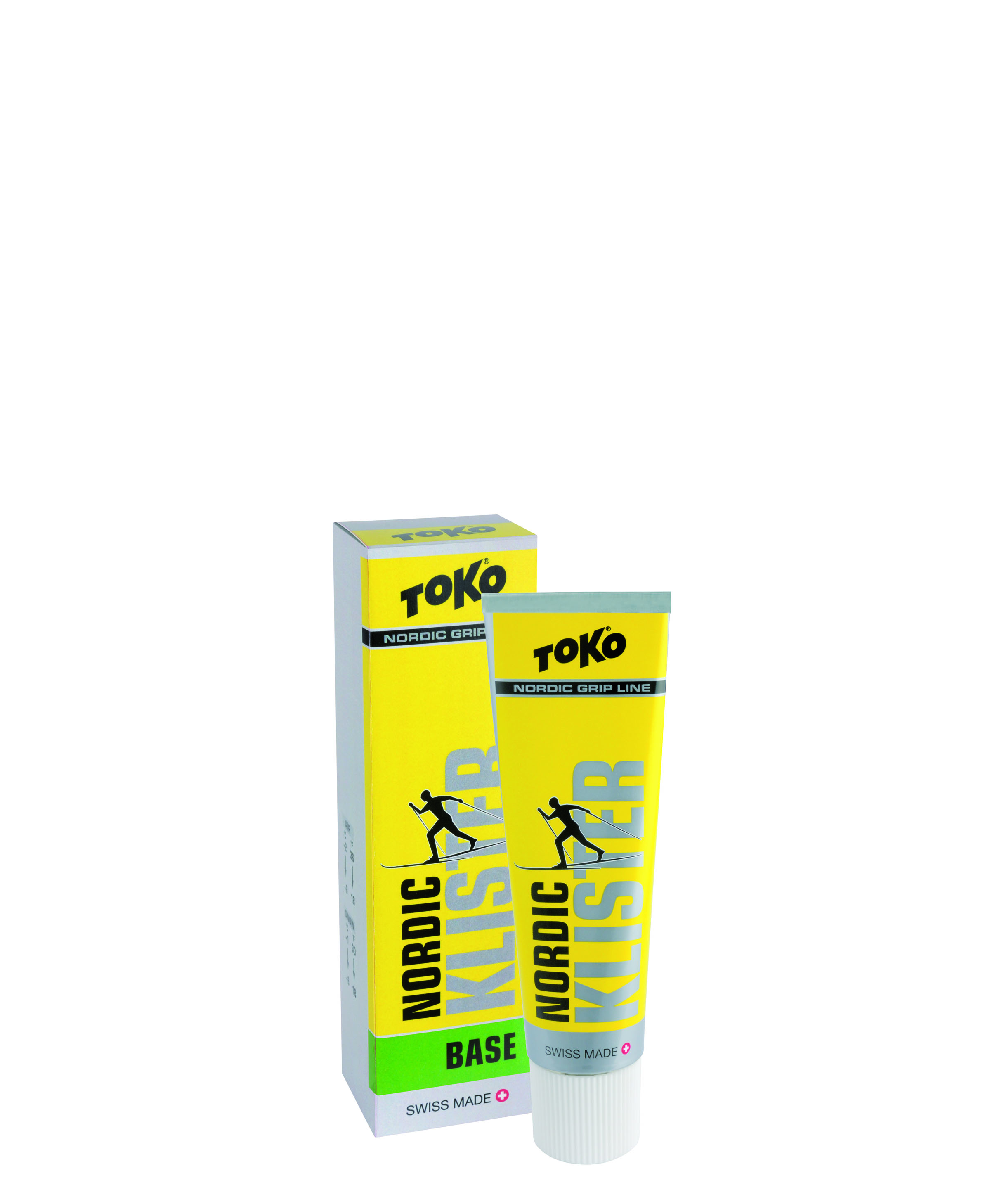 Gelbe Tube und Packung Toko Nordic Base Klister für Skilanglauf mit stilisiertem Skifahrer.