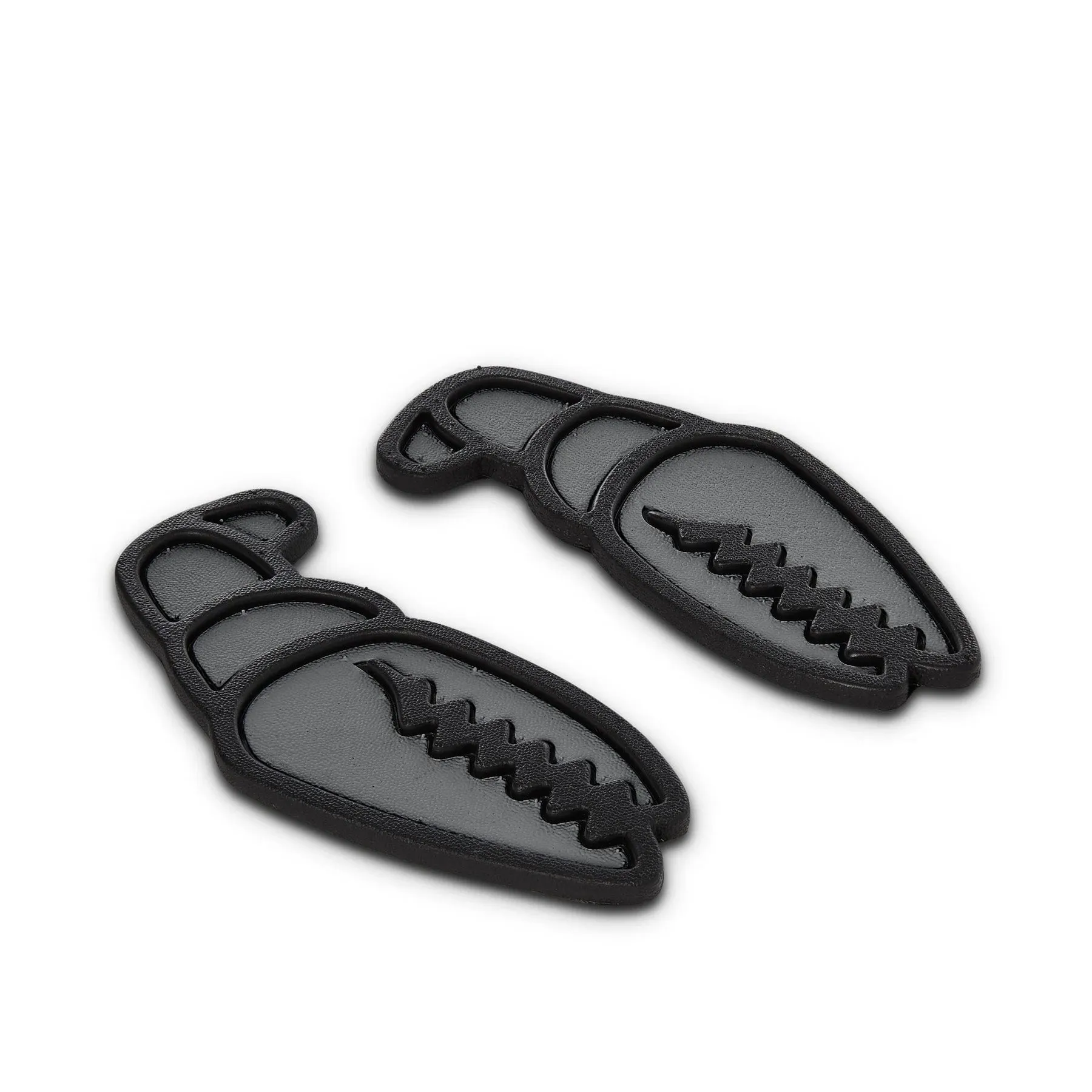 Two black, crab-claw-shaped snowboard stomp pads with a grippy foam surface. Each pad features a jagged Gripples texture for maximum grip. Matte black Stealth Mode design prevents slipping.