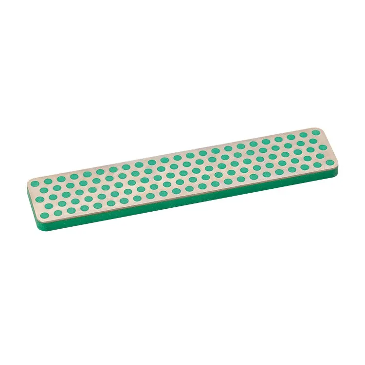 Rectangular, green diamond file with many small, round holes on a silver surface.