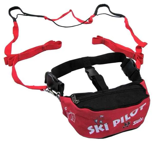 Red children's ski belt with black details and grab handles; "Ski Pilot SWIX" print visible.