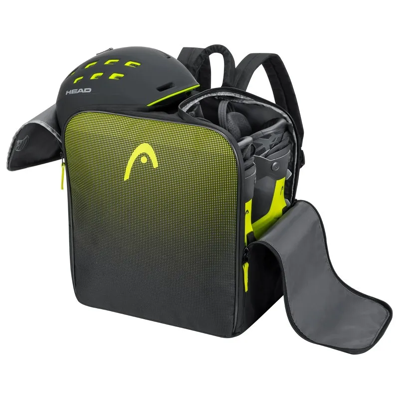 Sac à dos ouvert noir pour chaussures de ski Head avec casque et chaussures de ski. Logo et accents jaunes Head.