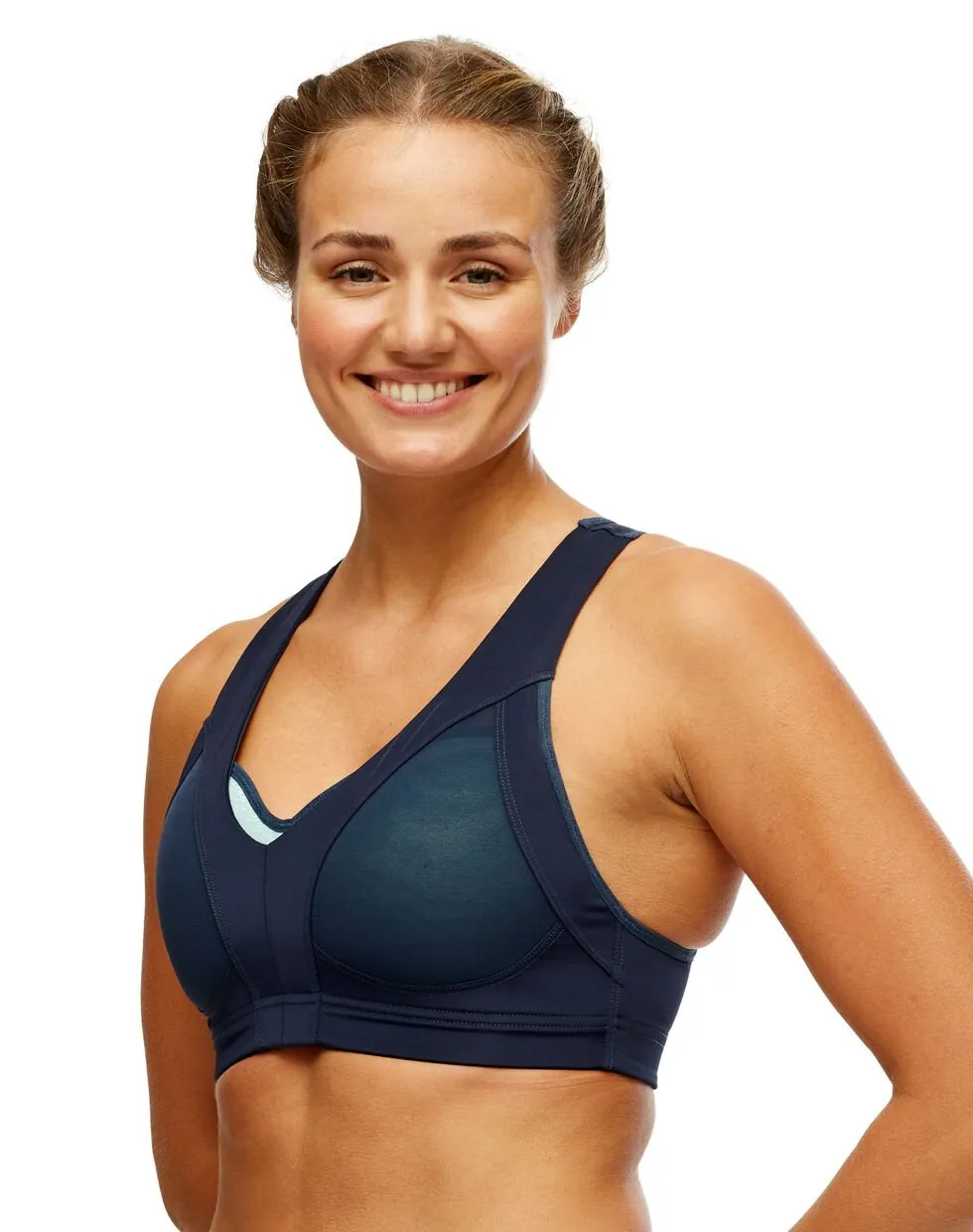 Model with Driva Sports Bra in navy blue, molded cups, adjustable straps.