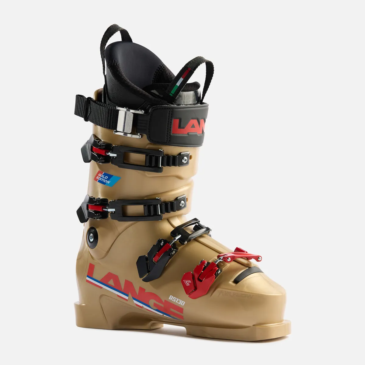A single, gold-colored ski boot of the brand Lange, model RS 130, with red and black details, stands in front of a light background.