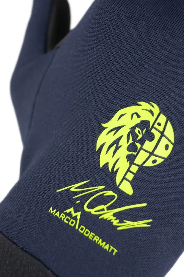 Vista dettagliata del guanto Reusch Miller Touch-Tec con logo Marco Odermatt.
