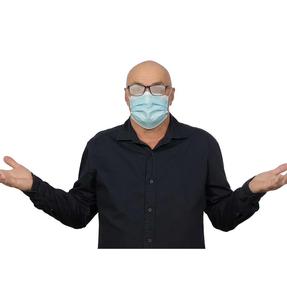 Man with fogged-up glasses and mask. He spreads his arms out helplessly.