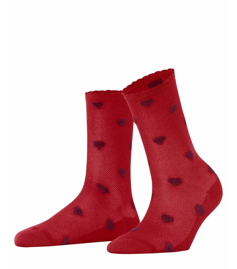Two red, transparent velour Beat socks with small, darker hearts and a ruffled cuff.