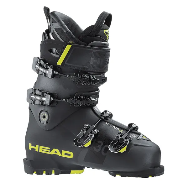 Une chaussure de ski noire de la marque Head avec des accents jaunes et quatre boucles.