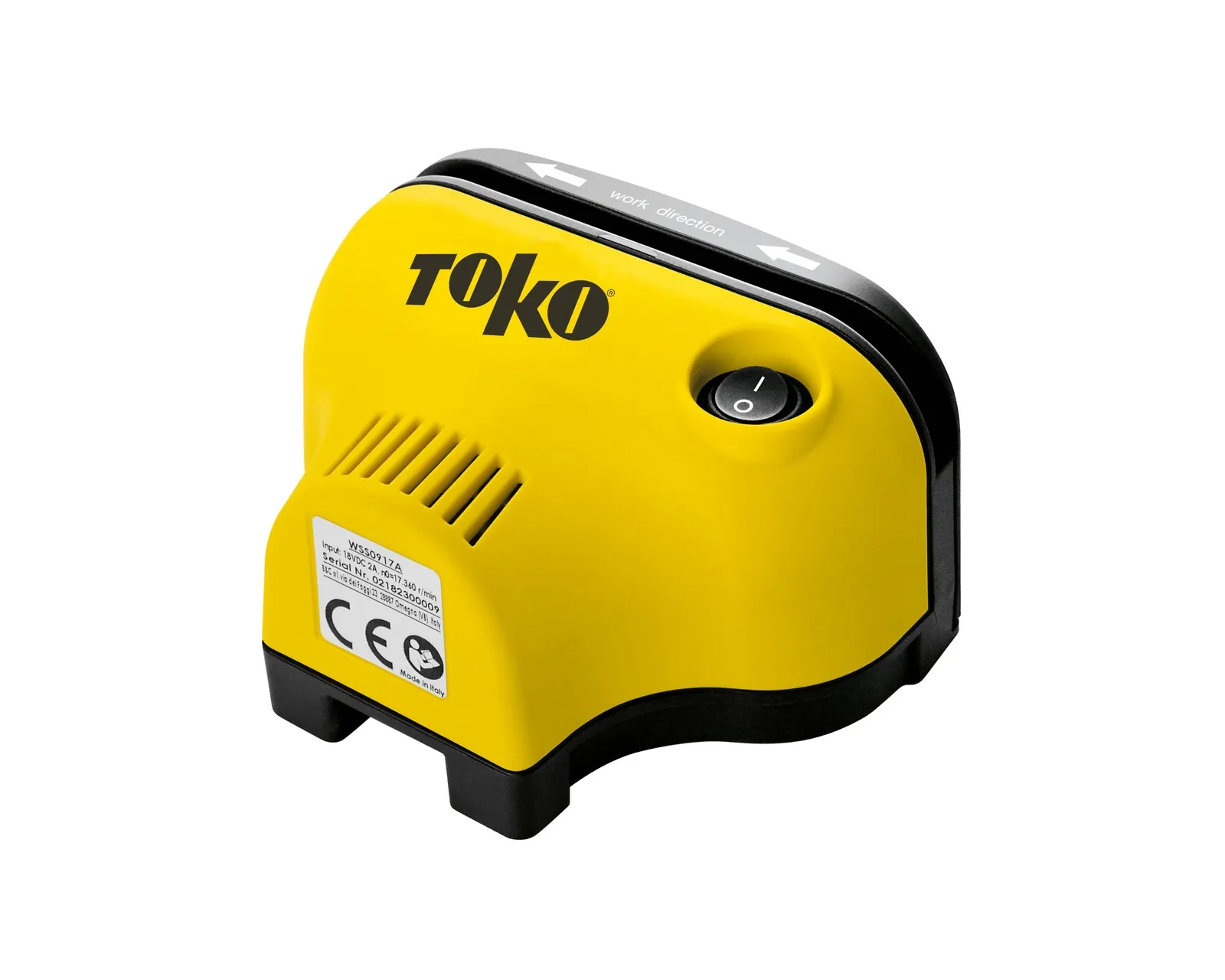 Yellow Toko tool with black edge and lettering. Arrows indicate the working direction. A round power button is visible.