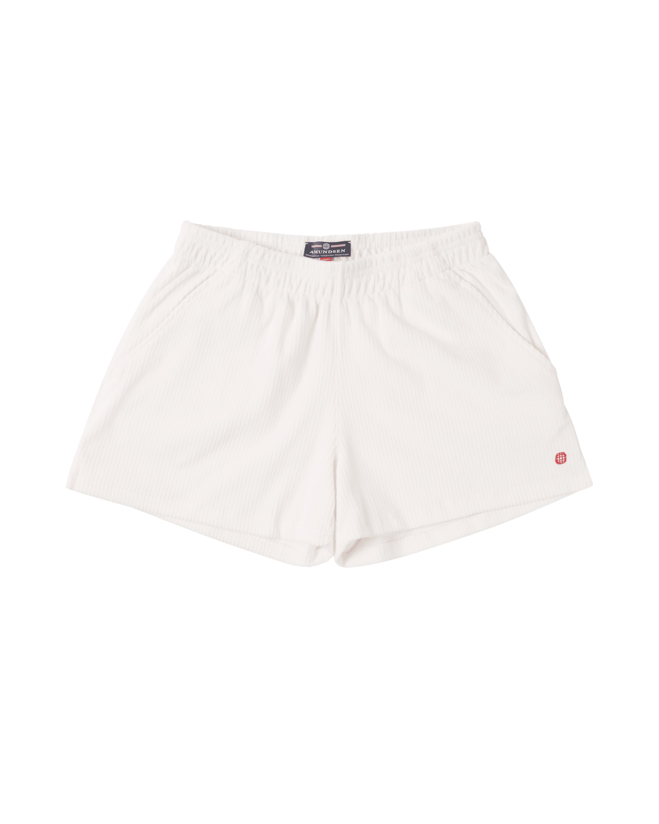 White, short corduroy shorts with an elastic waistband and a small red logo on the right leg.