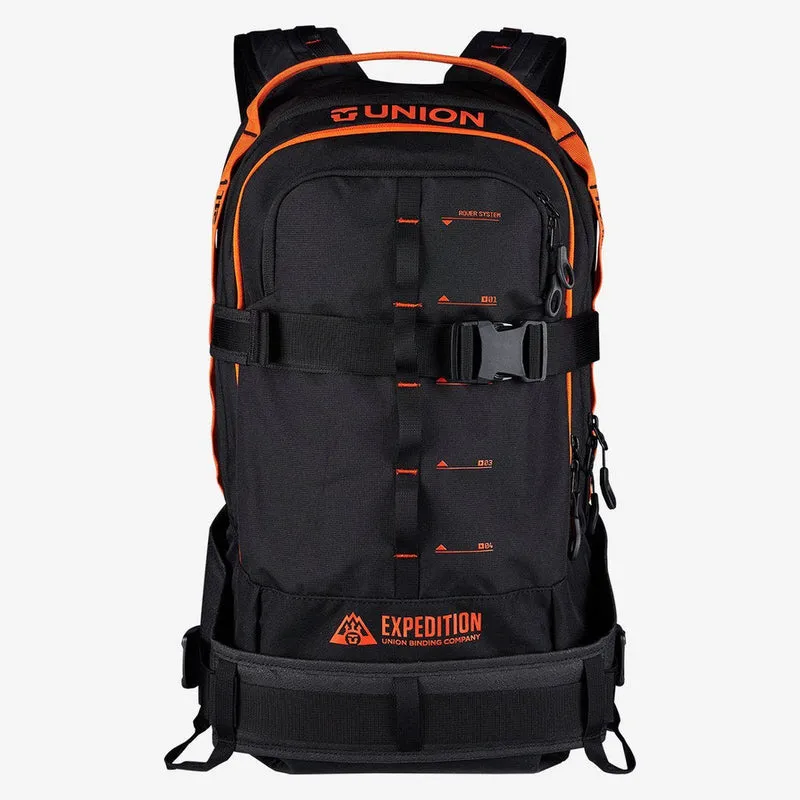Black Union Expedition backpack with orange accents and straps. Front view.