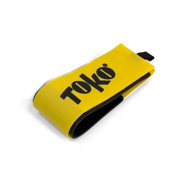 Gelber, gewebter Gurt mit schwarzer Innenseite und schwarzem „TOKO“-Logo.