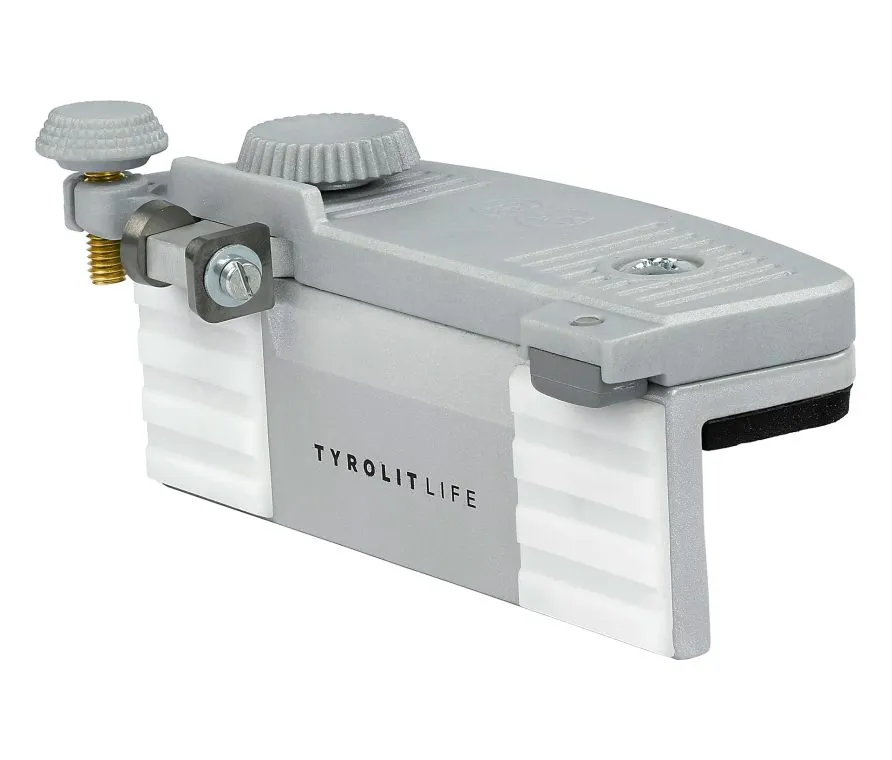 Utensile grigio con viti zigrinate e la scritta "Tyrolit Life", composto da diversi strati sovrapposti.