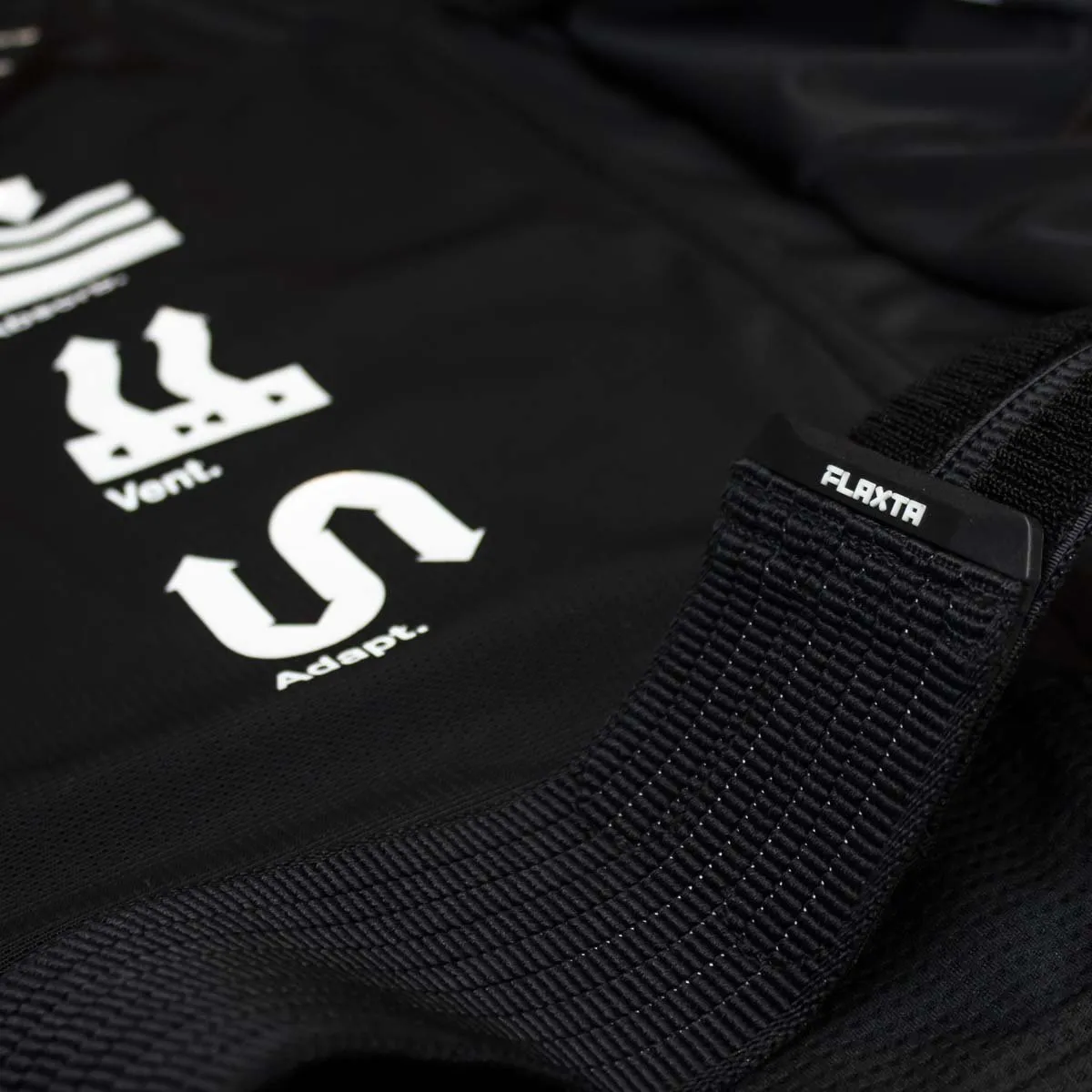 Close-up of the Behold Men back protector vest. Flaxta Logo and AVA system print.