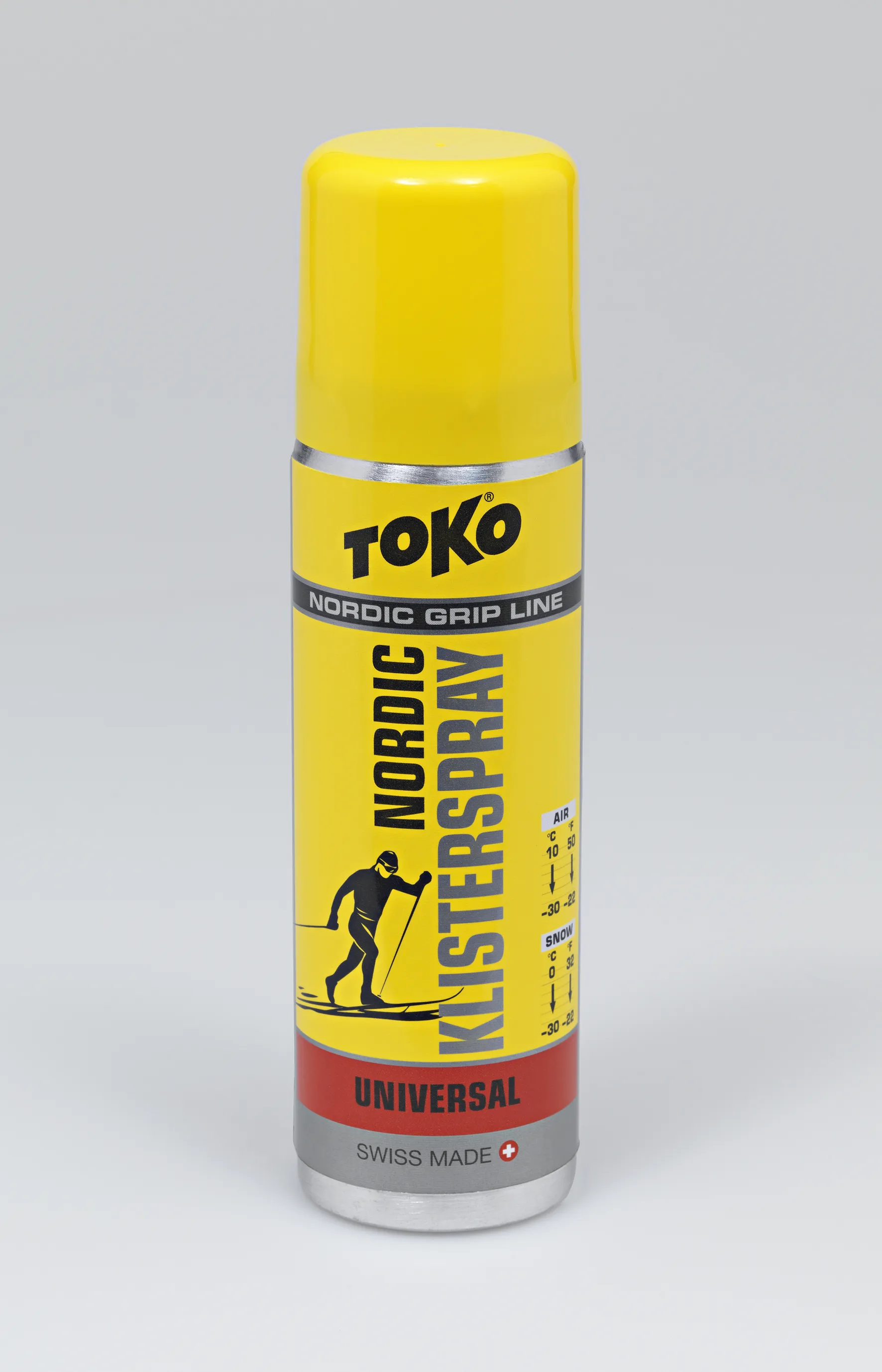 Gelbe Spraydose Toko Nordic KlisterSpray Universal mit Skifahrer-Illustration und Temperaturbereich.