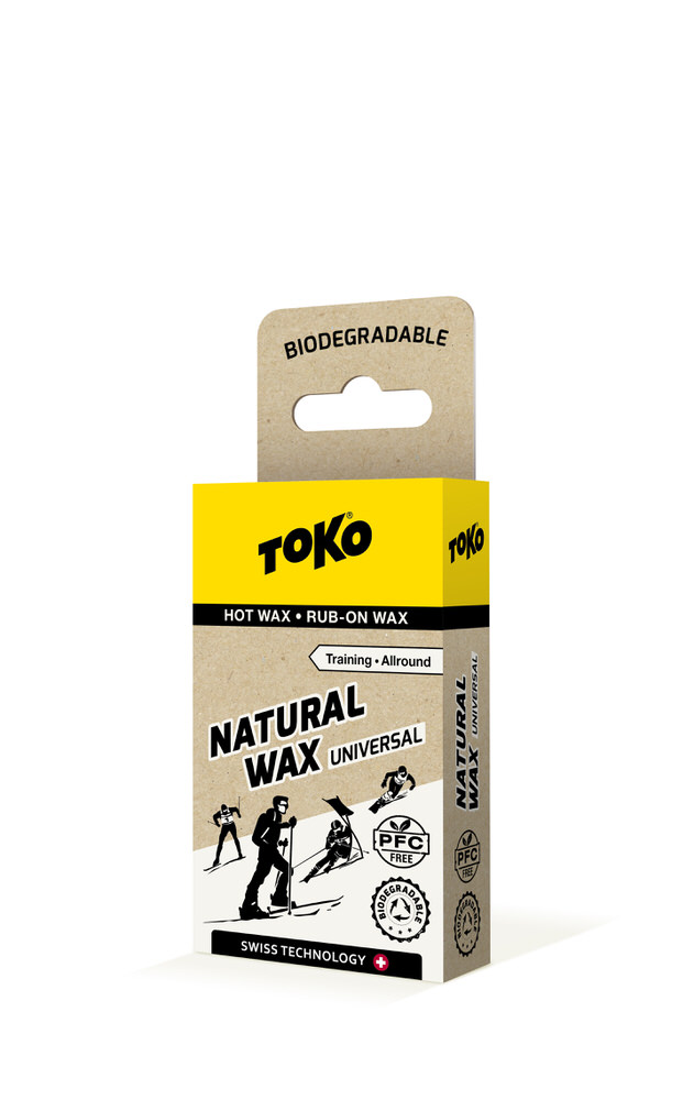 Verpackung von Toko Natural Wax Universal, gelb und beige, mit Text und Skifahrern.