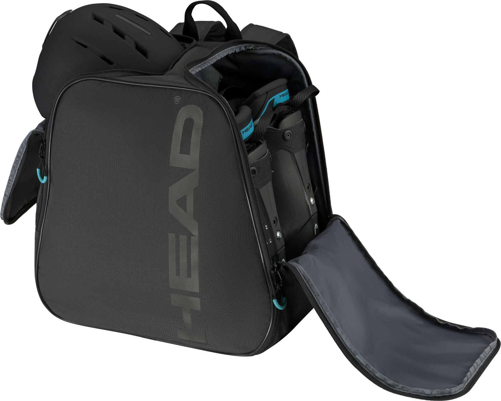 Sac à dos Head Boot noir avec casque et chaussures de ski. Le sac a des compartiments ouverts.