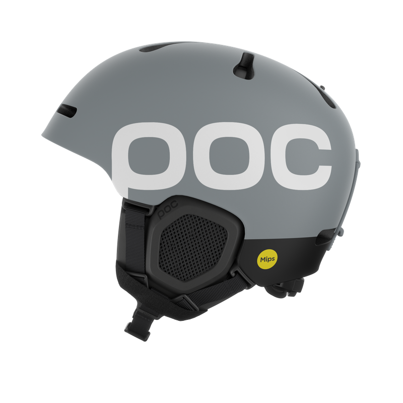 Grauer POC Skihelm Grauer Skihelm der Marke POC, Seitenansicht, mit weißem POC-Logo, Ohrenschutz und Mips-Aufkleber.