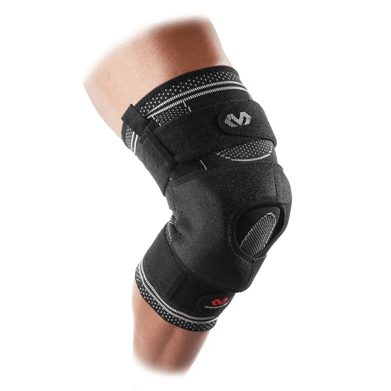 Knee with black MCDavid Elite knee brace, shown sideways and slightly bent.
