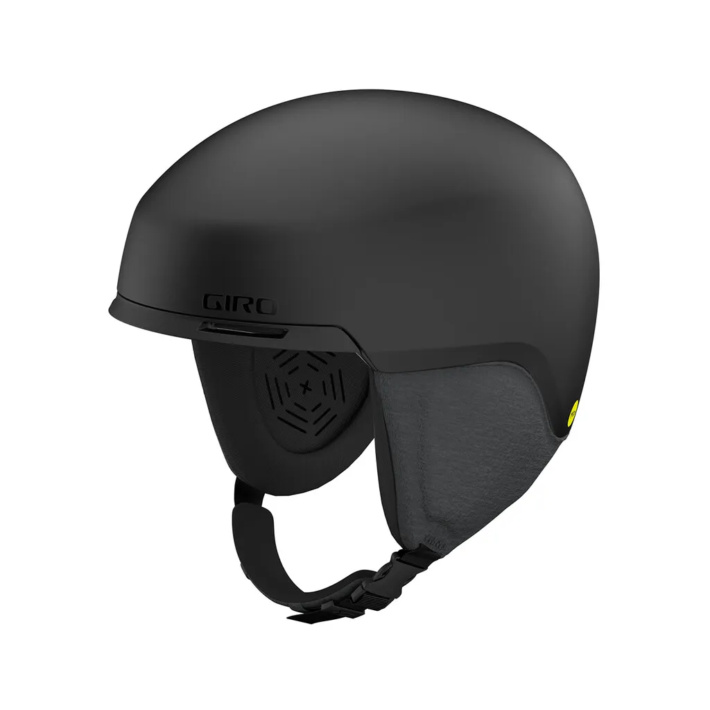 Matt black Giro Tagert MIPS ski helmet, side view. Ear pads and chin strap visible.