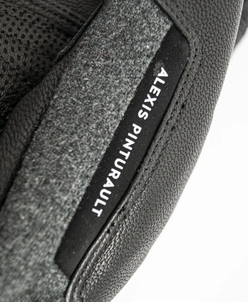 Detailed view of the Reusch Alexis Pinturault GTX glove with leather and Alexis Pinturault lettering.