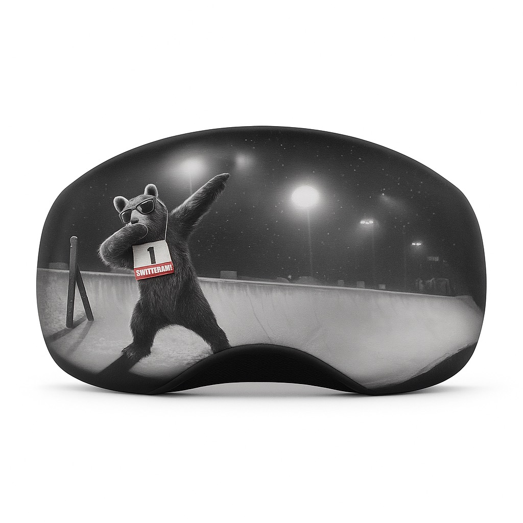 Ski goggles with black and white print: bear with start number doing a "dab" in front of a snowy backdrop.