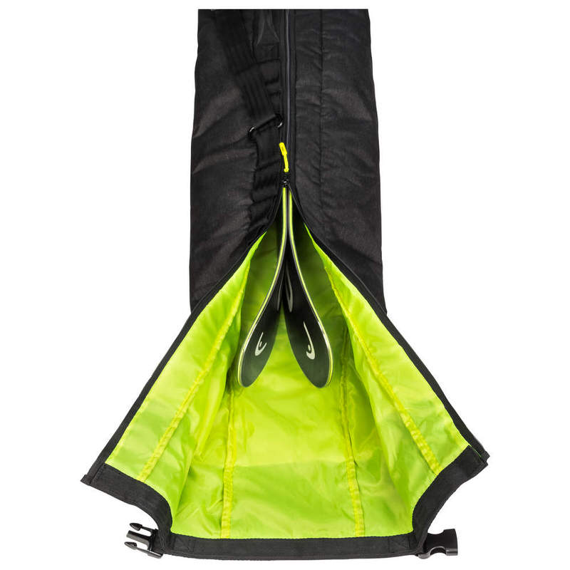 Opened, black ski bag with neon green lining, two skis sticking out slightly.