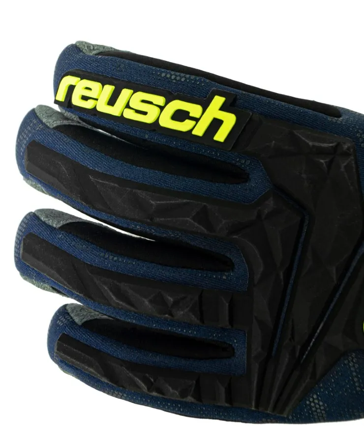 Vista dettagliata di un guanto da sci Reusch Marco Odermatt in blu e nero con logo giallo.