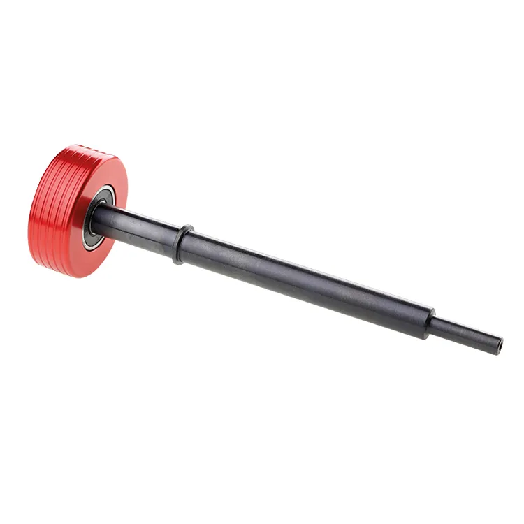 Close-up of a Snoli mandrel for rotor brush in aluminum, red wheel, black rod.