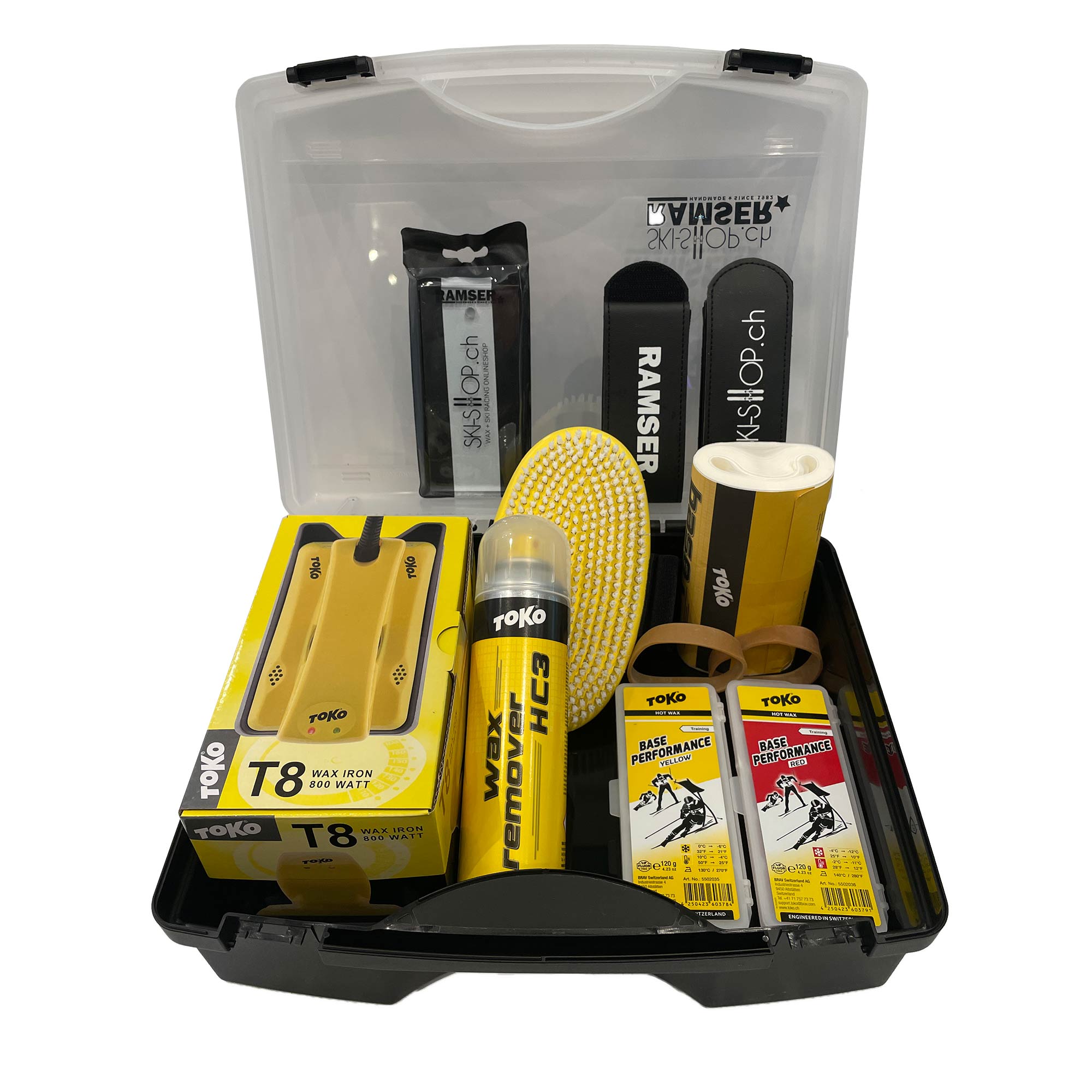 Offene Basic Wax Box Set gefüllt mit Skiwachs, Wachsbügeleisen, Reiniger, Bürste und Werkzeug für Ski- und Snowboardpflege.