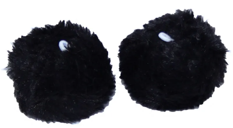 Two fluffy black pom-poms on a white background. Each has a small white loop for attachment. Decorative winter accessories for kids, perfect for adding a playful touch to hats, balaclavas, and more— Look.