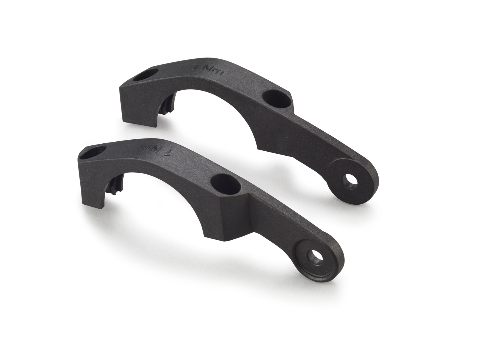 Zwei schwarze Lupine Halterungen für Bosch E-Bike Beleuchtung, zur Montage am Display. Bohrungen und Aussparungen sind erkennbar.