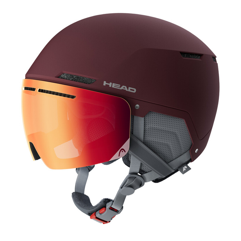 Burgundy-colored visor helmet Burgundy-colored Head Cinema Pro W visor helmet with orange visor in profile.
