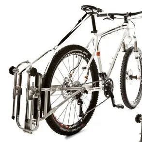 Bicycle with mounted FollowMe tandem coupling and attached child's bike. Close-up of the hitch on the bike.