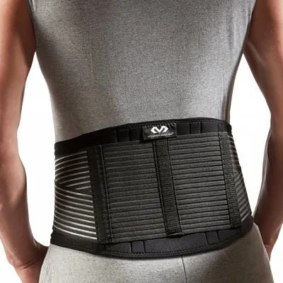 Person with McDavid back support. The support is black and has horizontal stripes.