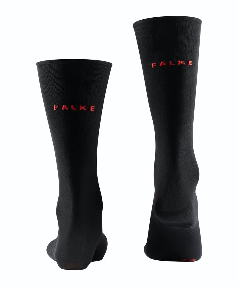 Zwei schwarze Falke SK7 Herren Skiing Kniestrümpfe mit roter Logo Aufschrift.