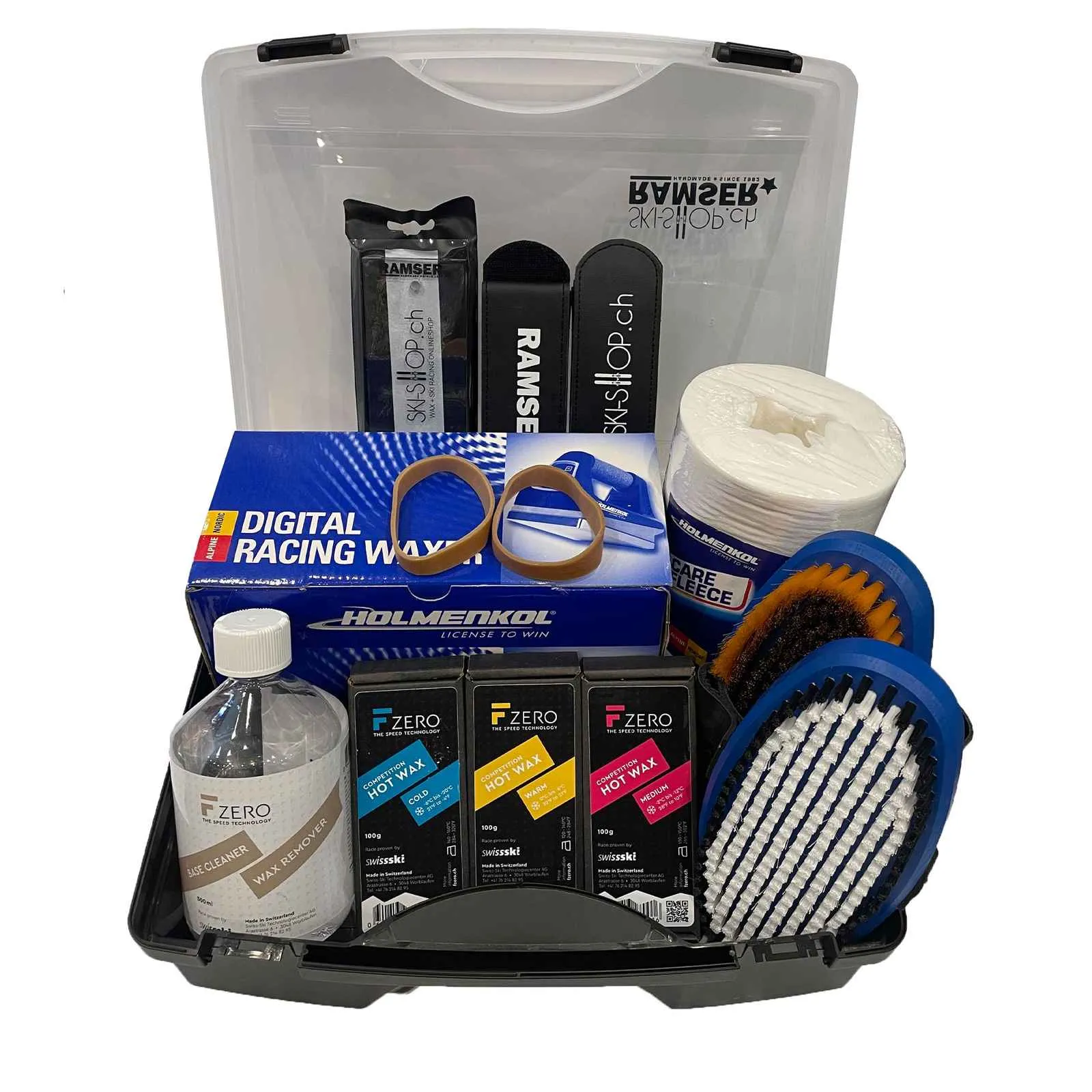 WC Pro Wax Box Contents: F-Zero waxes, cleaner, Holmenkol irons, brushes, Ramser tools in transparent plastic box.