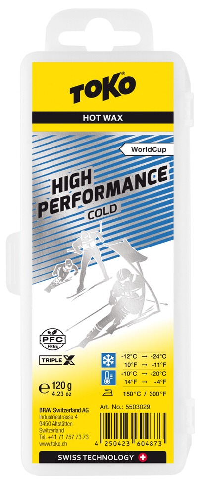 Verpackung Toko High Performance Triple X Cold Wachs, gelb-silber mit Skifahrer-Illustrationen und Temperaturangaben.