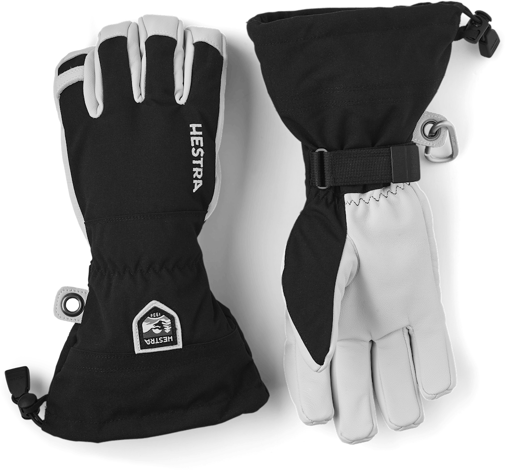Hestra Ski-Handschuhe Zwei Hestra Army Leather Heli Ski Mitts, eine mit Handfläche nach oben, die andere nach unten.