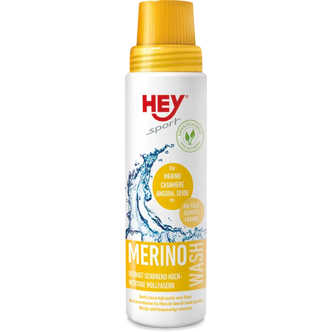 Weiße Flasche Hey Sport Merino Wash mit gelbem Deckel und Text für feine Wollfasern.