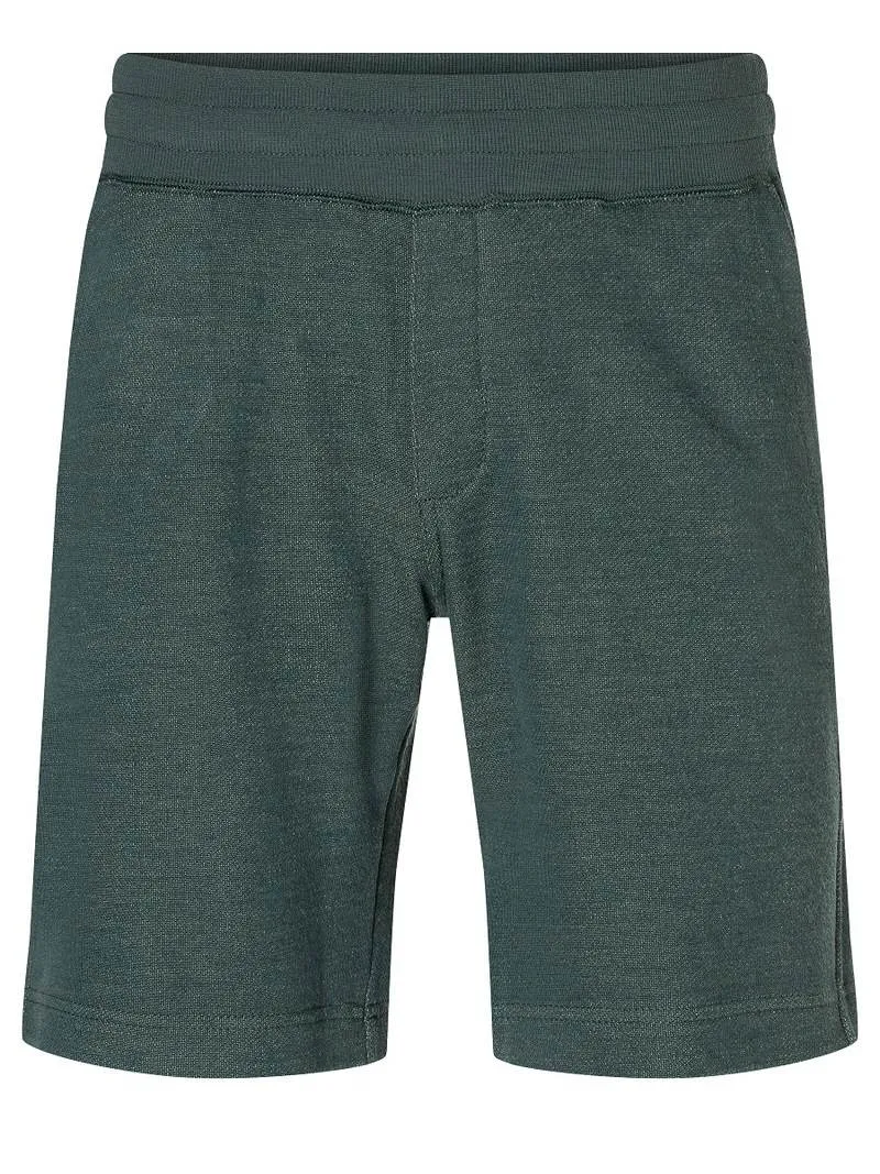 Close-up: Knitted shorts in dark green with an elastic waistband.