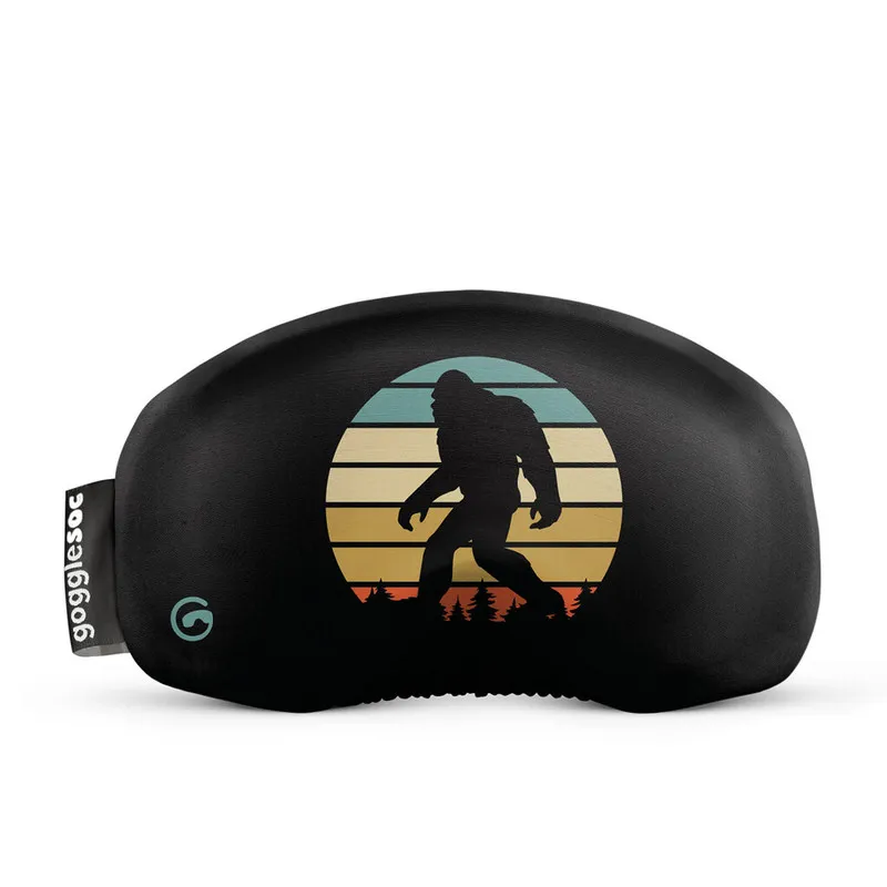 Black gogglesoc ski goggle cover with Sasquatch silhouette in front of a retro-colored sunset.