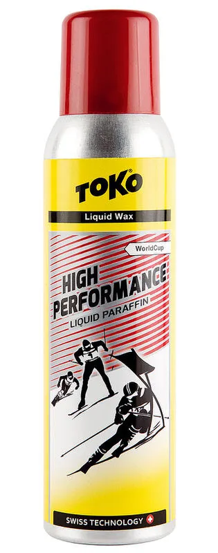 Gelbe Dose Toko High Performance Liquid Paraffin Red mit Skifahrer-Illustrationen. Roter Deckel.