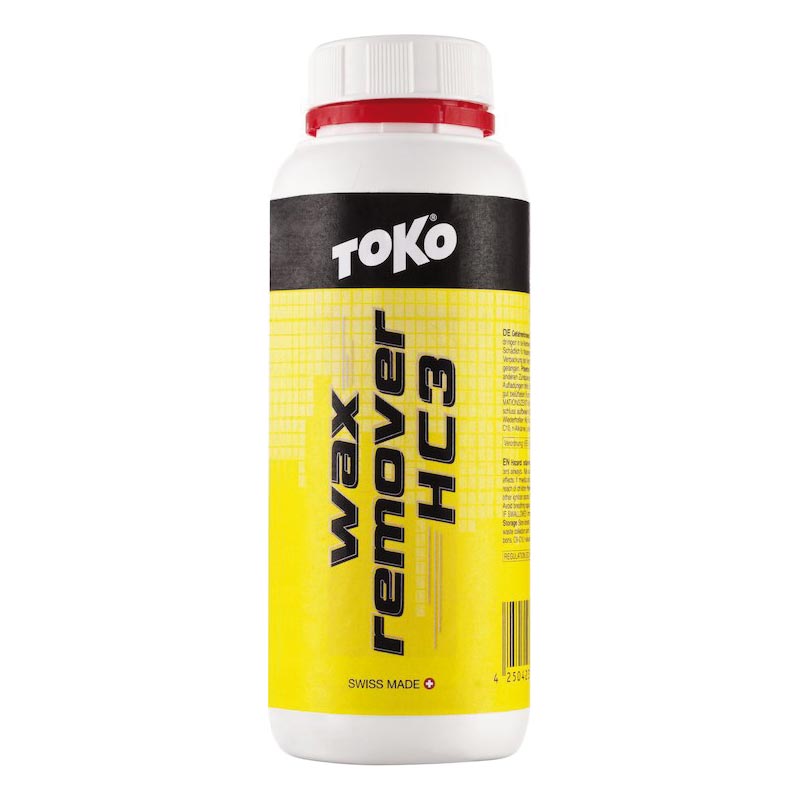 Gelbe Flasche Toko Wax Remover HC3 mit weißem Deckel und rotem Ring. Schwarze Aufschrift, Barcode und Warnhinweise.