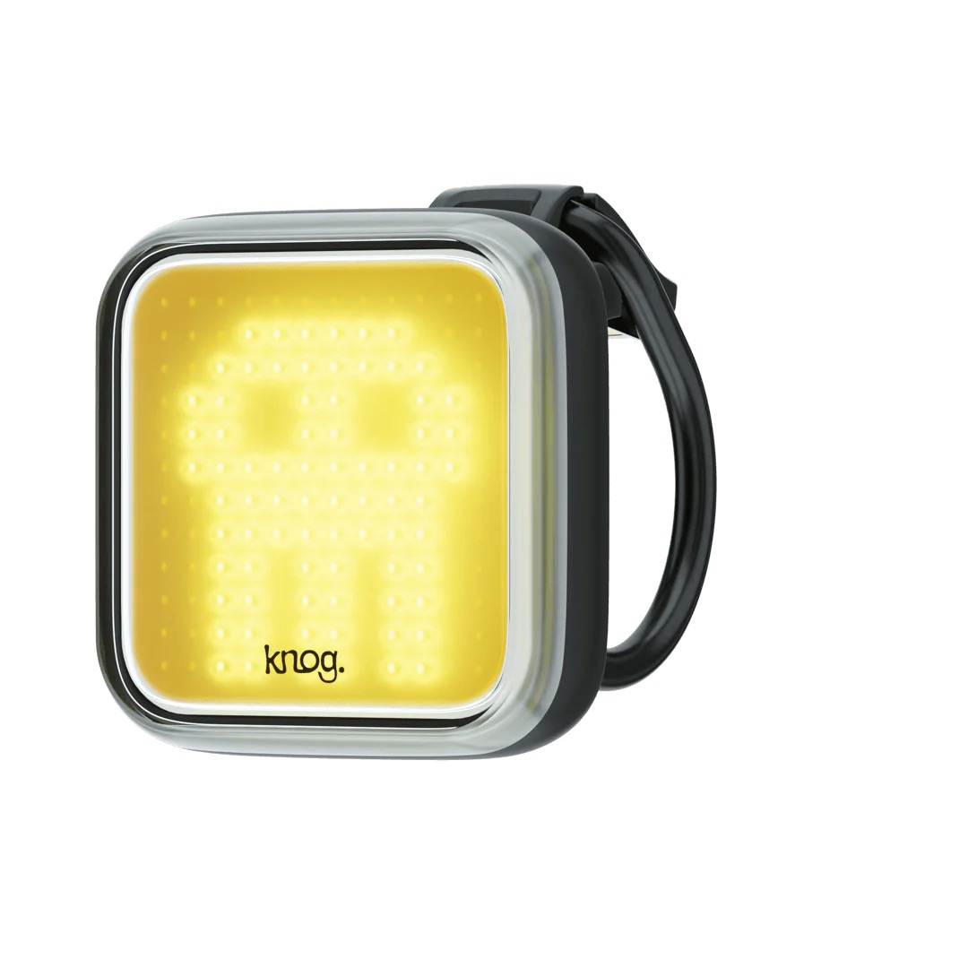 Frontale Fahrradlampe mit Schädelmuster, leuchtend gelb, Marke Knog, mit Halterung.