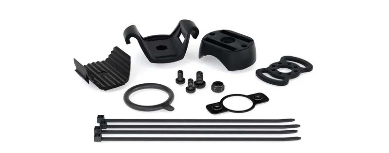 Pièces détachées noires Suprabeam Support pour vélo : Supports, vis, bague d'étanchéité et serre-câbles sur fond blanc.