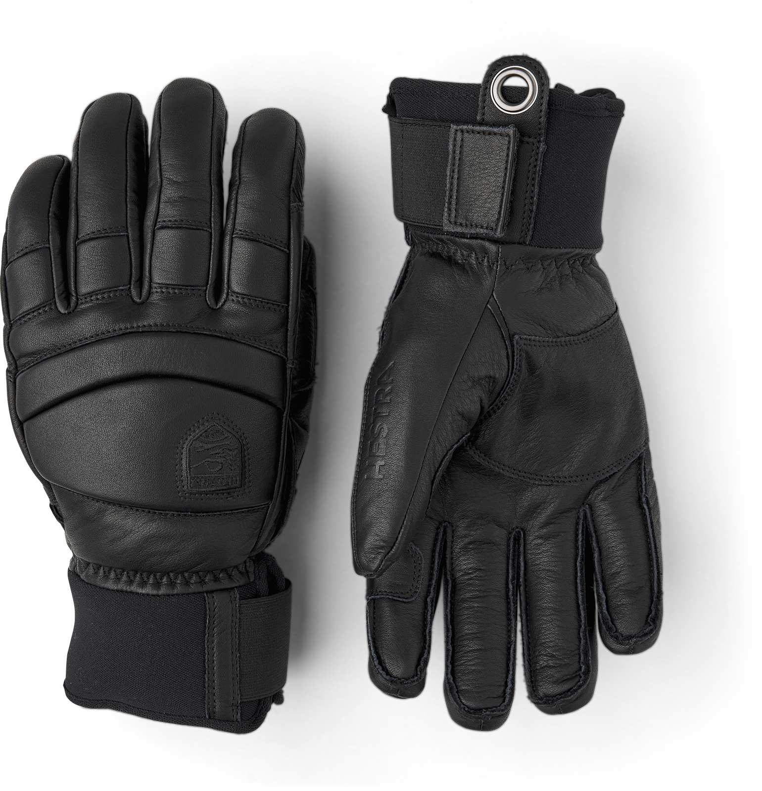 Schwarze Hestra Lederhandschuhe Zwei schwarze Hestra Fall Line Lederhandschuhe liegen auf einem weißen Hintergrund.