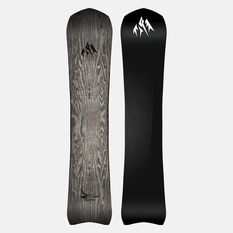 Snowboard Jones Freecarver 6000s: One side wood grain, other side black with white mountain logo.