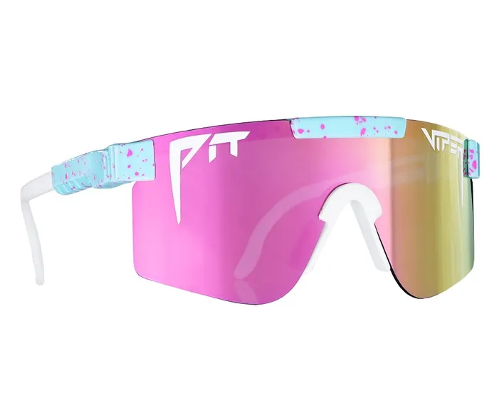 'The Gobby Polarized' sunglasses: Pink lenses, white frame, light blue accents with pink dots.