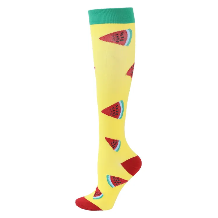 Yellow ski sock with melon pieces, red heel and toes and green cuff.